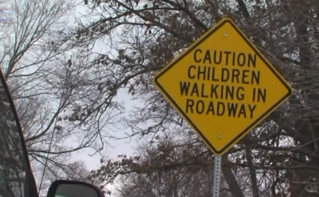 Lack of sidewalks forces Maplewood Elementary students to walk on roads to and from school. Image taken from Fox 4 News video. 