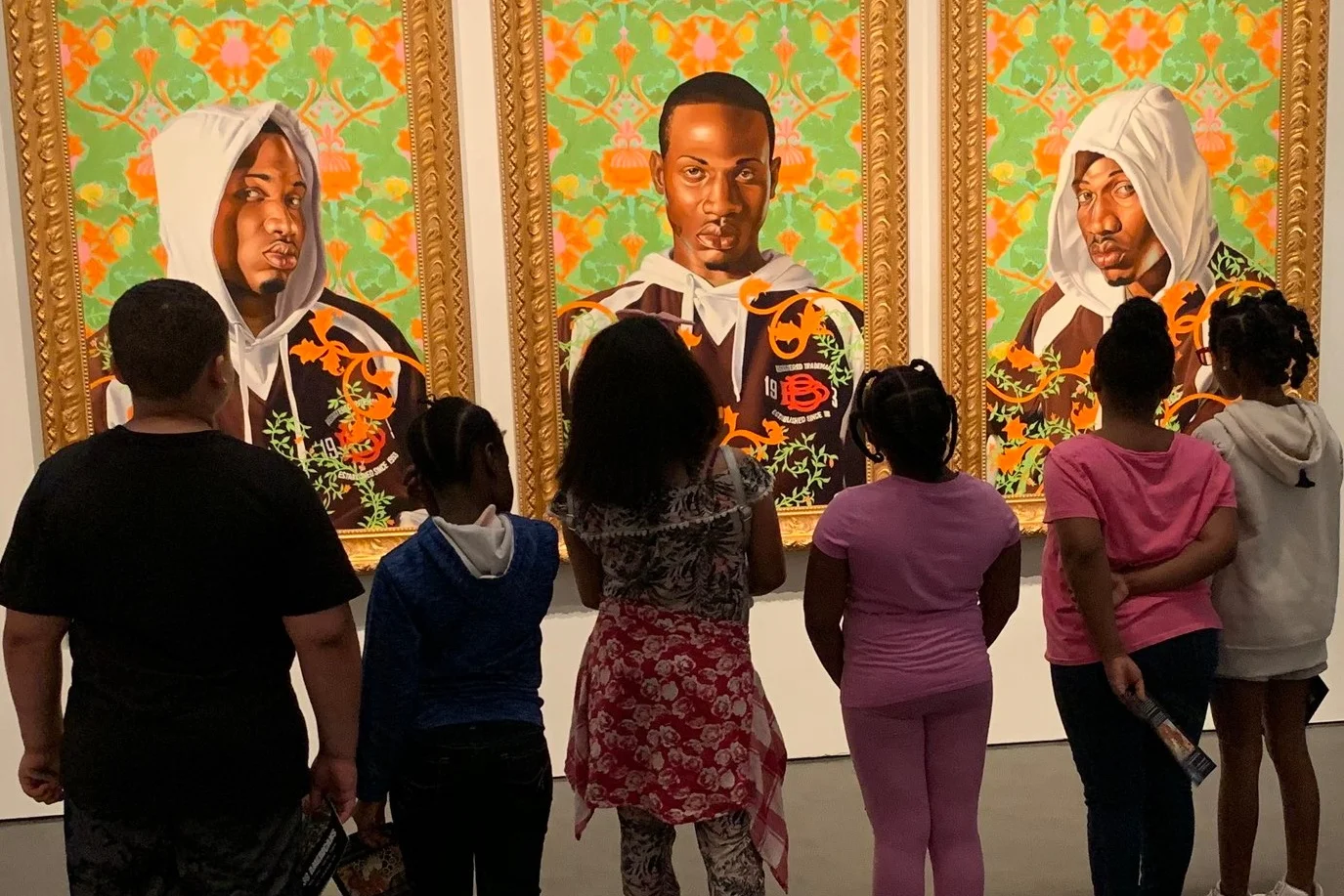 Children from LINC’s summer program at Wendell Phillips Elementary School study the Kehinde Wiley painting, “Triple Portrait of Charles I,” at the Nelson-Atkins Museum in Kansas City. Photo by Jamie Braden