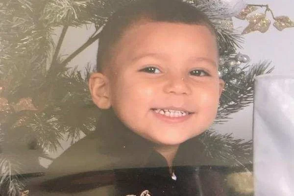 Center Elementary School and LINC student Brian Bartlett, 8, smiles in a Christmas photo shared by his family on a GoFundMe page raising money for his burial costs and family support.