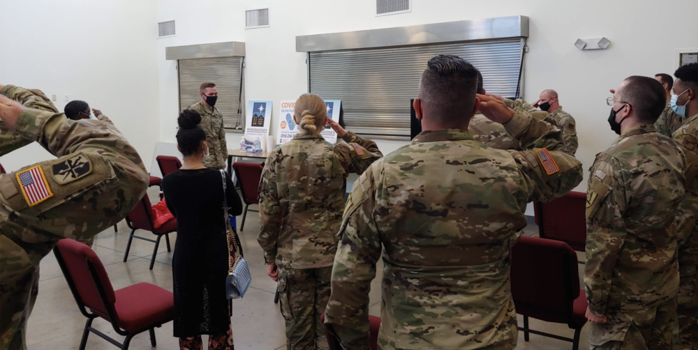 Members of the Missouri Air and Army National Guard salute Capt. Tony Rich at the Morning Star/LINC vaccination clinic on his last day of service with the Guard, May 13. Rich had extended his service by two months to remain on the vaccination mission.