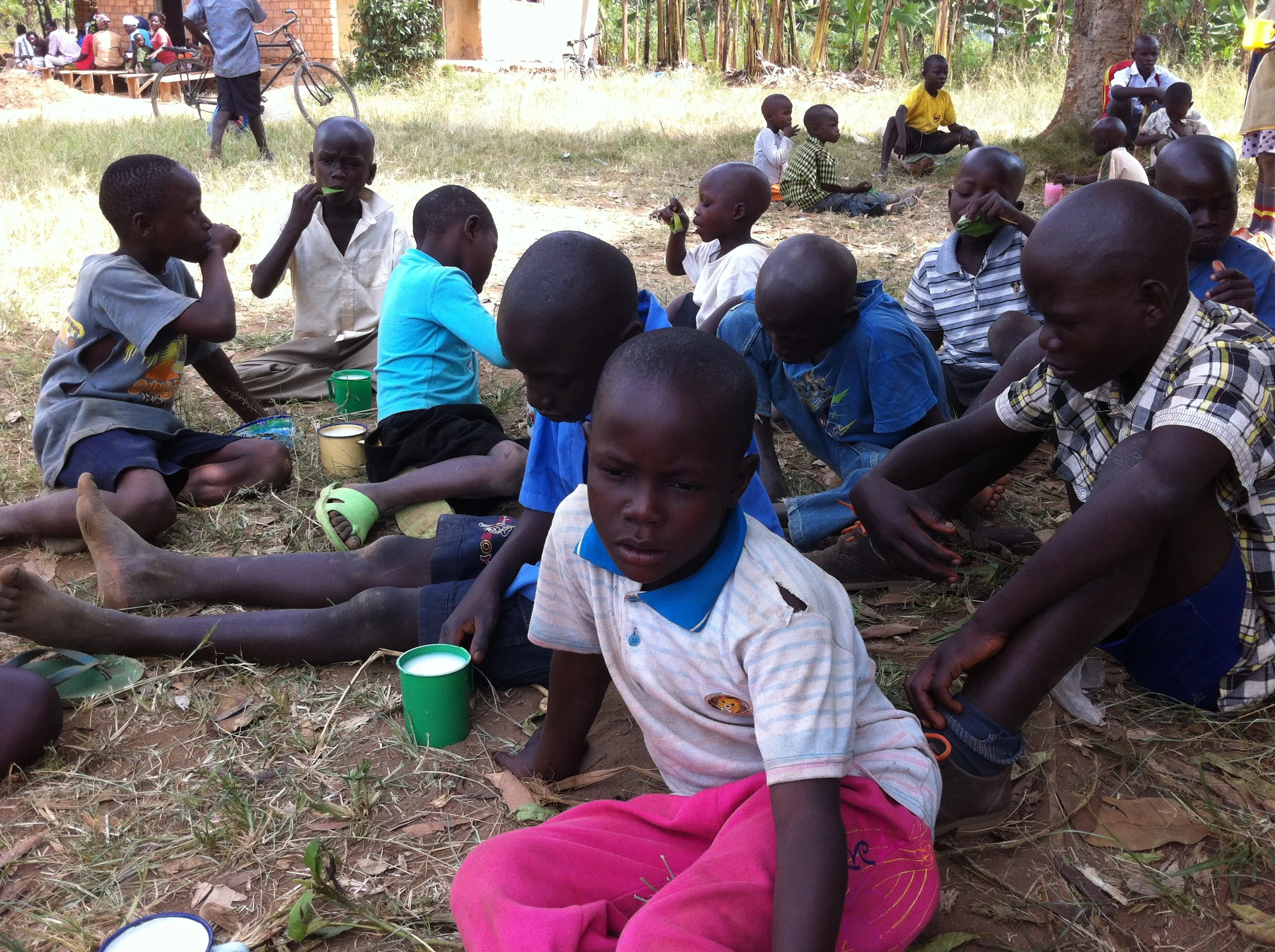 Some of our kids taking porridge as their daily meal.