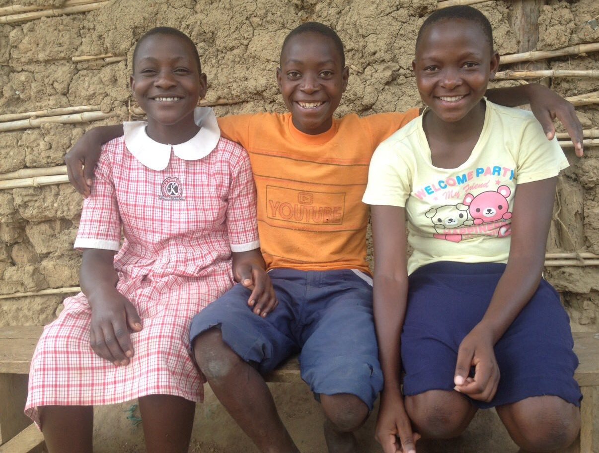 From the left Patricia (in pink), Jibu (orange) and Oliver (green) being sponsored by Jennifer and the two sons (Xander and Chase).
