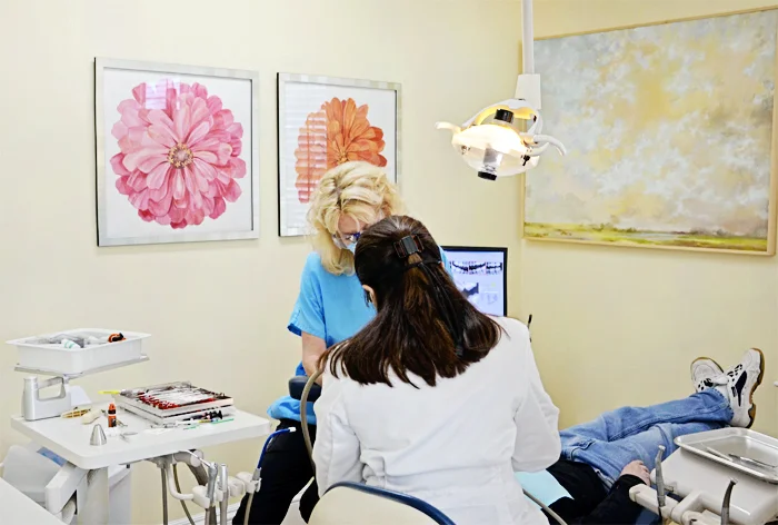 sally+vail+photo+working+on+patient+slightly+darker-1.jpg