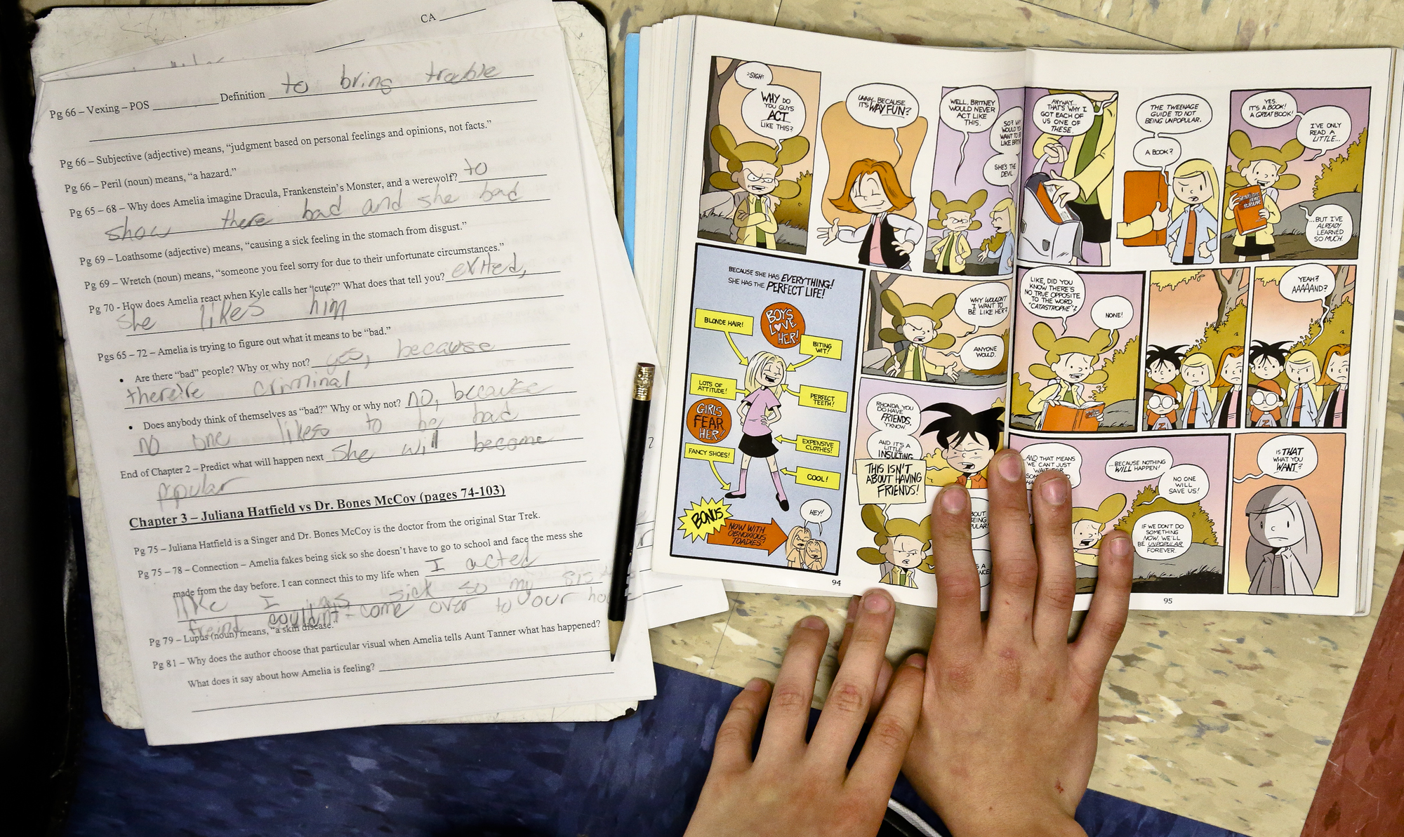 Fifth-grader Joshua Miles, 11 reviews the graphic novel "Amelia Rules" in Ashley Ayres, communications arts teacher's classroom at South Eastern Middle School West, Fawn Township Monday, April, 28, 2014. Photo by Sonya Paclob
