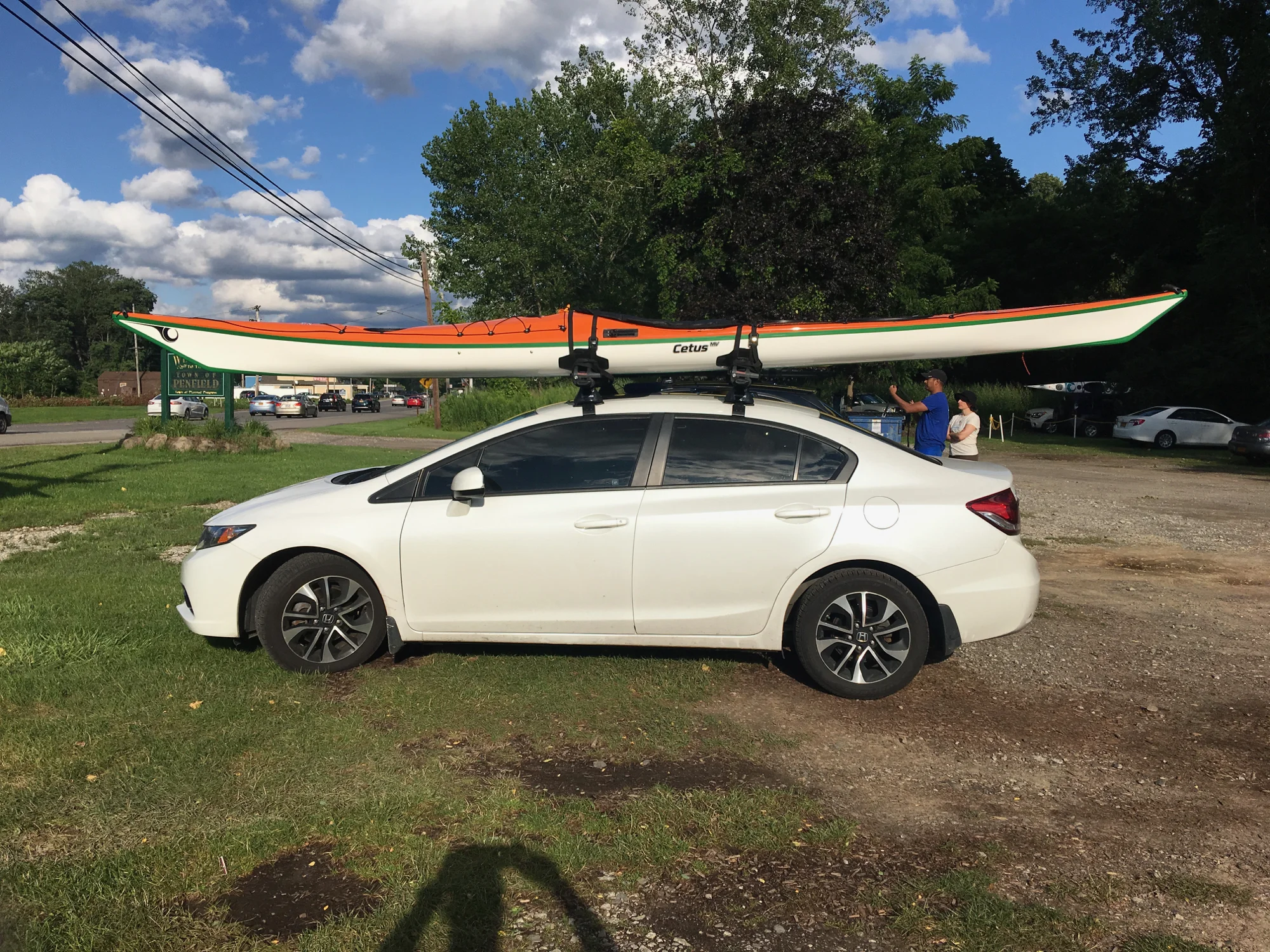 My new baby on top of my car. This Cetus has the expedition layup in Diolen (fiberglass) with additional glass around the middle section and kevlar keel strip. 