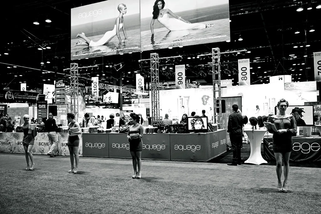 The doors are about to open. Models are in place in front of our booth to greet ABS show goers, as well as on stage to showcase beautiful hairstyles. 