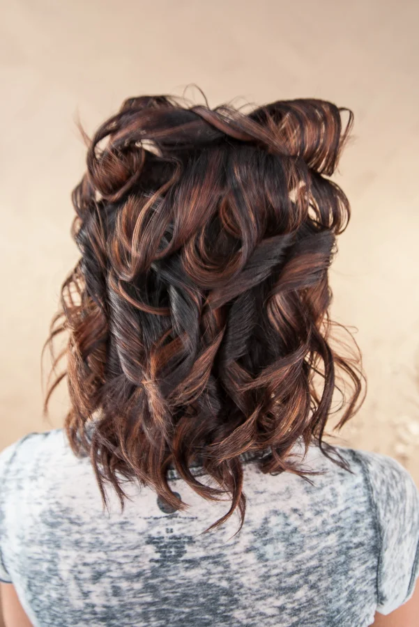 On the top section of the hair, do the flat iron curls the same as before, only turning the flat iron under instead of up. This will give you more volume on the top.