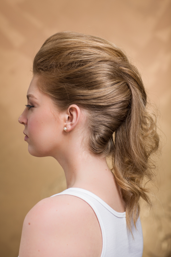 After smoothing & controlling, drape the section over the center where the two french twists join. You can either leave it as is or add a few bobby pins to secure the pony in. And here is your finished style.