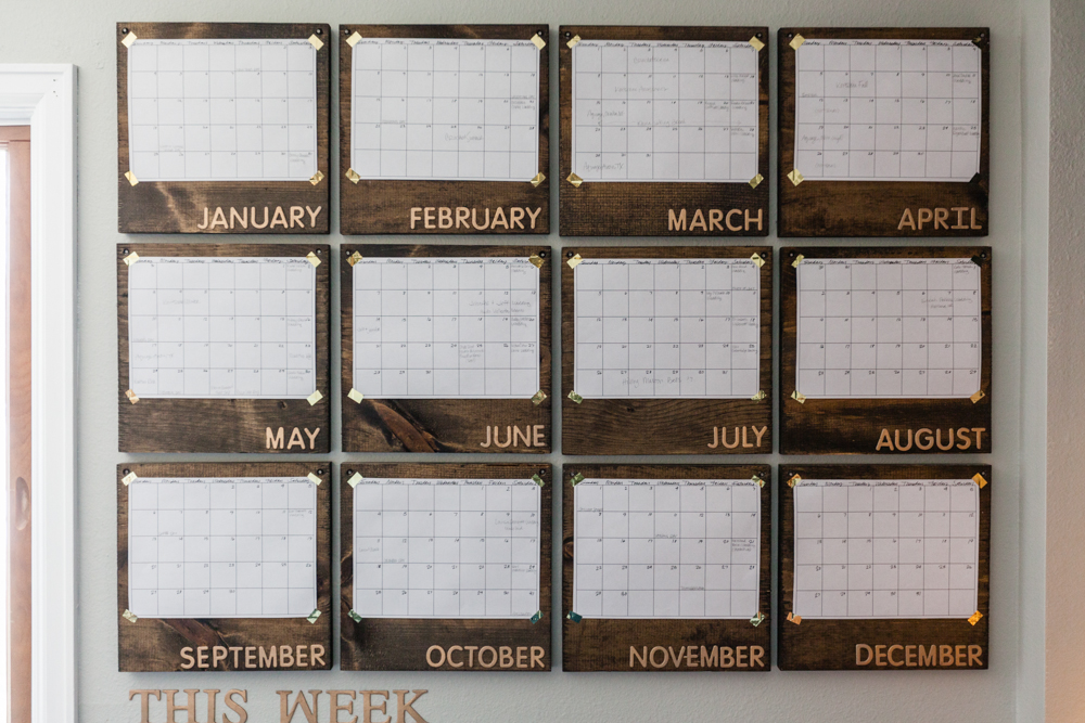 I live by calendars. Everything is done in Google calendar but I have to have a paper calendar on my wall to see my year as a whole so I don't over schedule myself like I have in the past. I finally found a way to make my paper calendar look aesthetically pleasing to my eye. Stained pine wood from Home Depot, papers attached with gold washi tape, r aised letters from Hobby Lobby, sprayed with gold spray paint. 