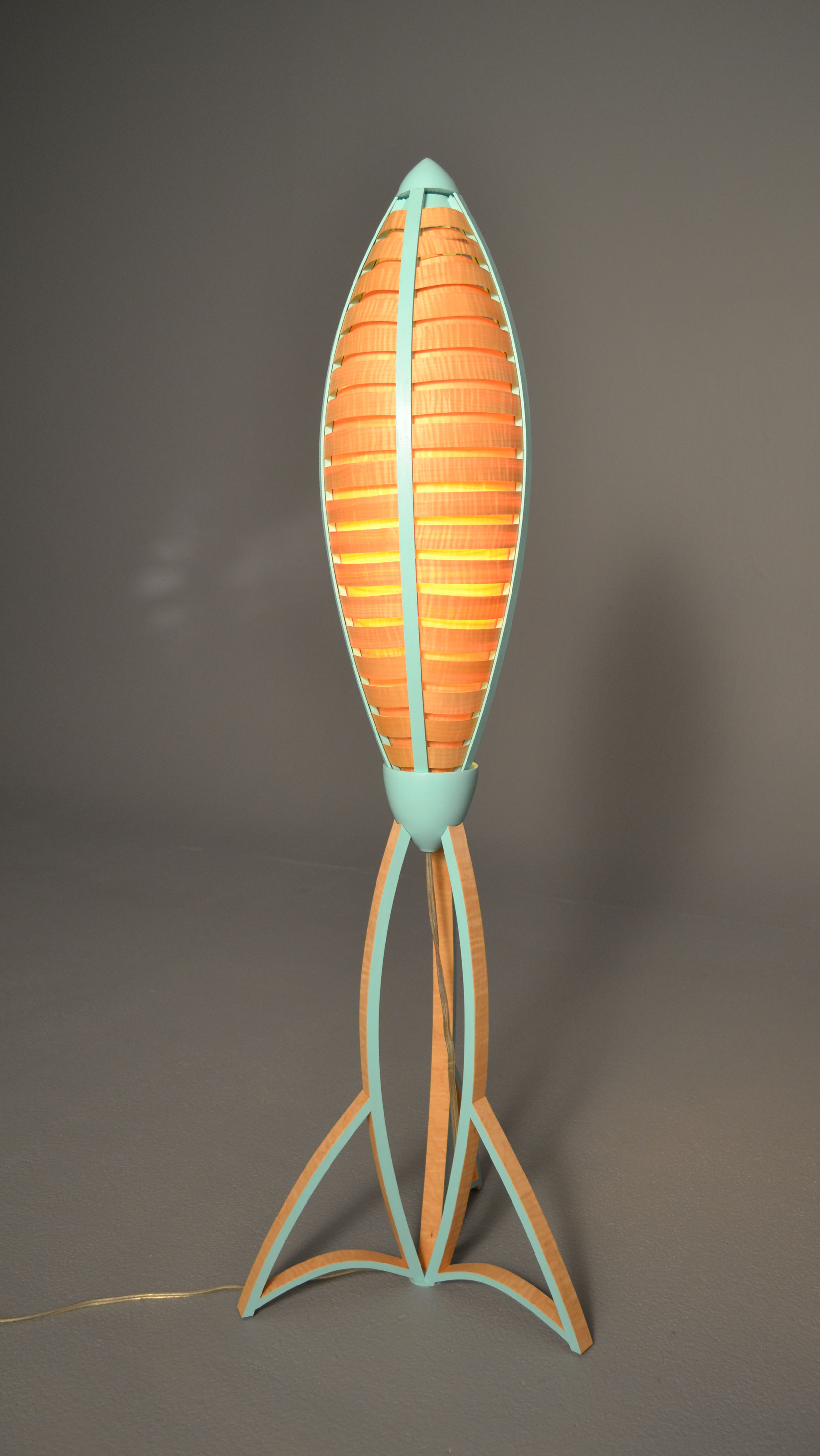      Tsiolkovsky Lamp - Tabletop Version , 2013   3' x 13" x 3'​  Curly Maple Veneer, Poplar, Paint  Photographed by Ryan Gray 