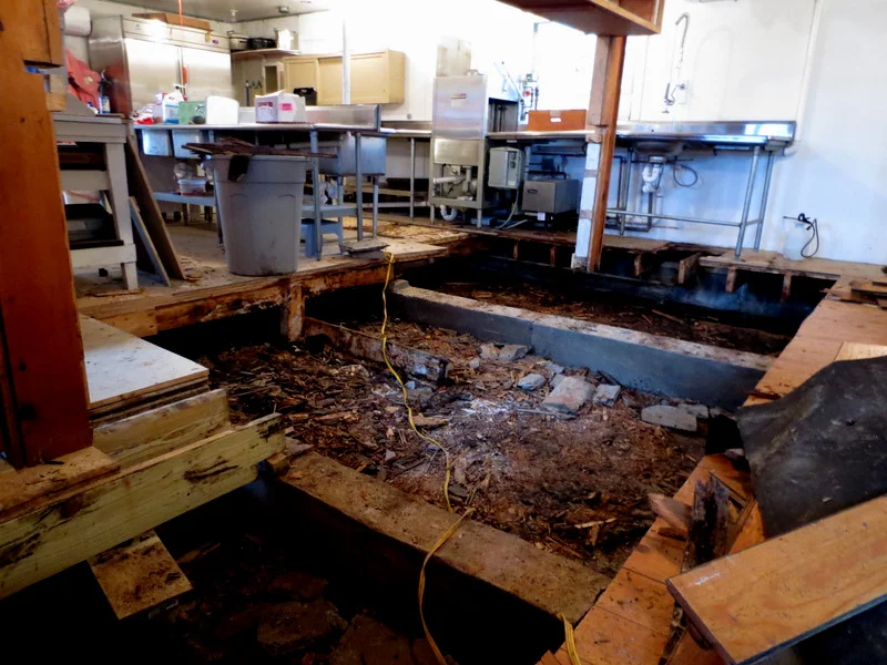 ​A big hole in the kitchen floor.