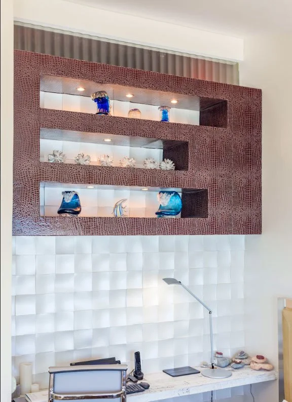 Clever Niche - once an opening to the stairwell, privacy and esthetics achived with smart ose of crocodile cladding of the display, flanked above with decorative glass to illuninate stairs and 3D wall panels in metallic pearl paint. Cozy desk fitted 