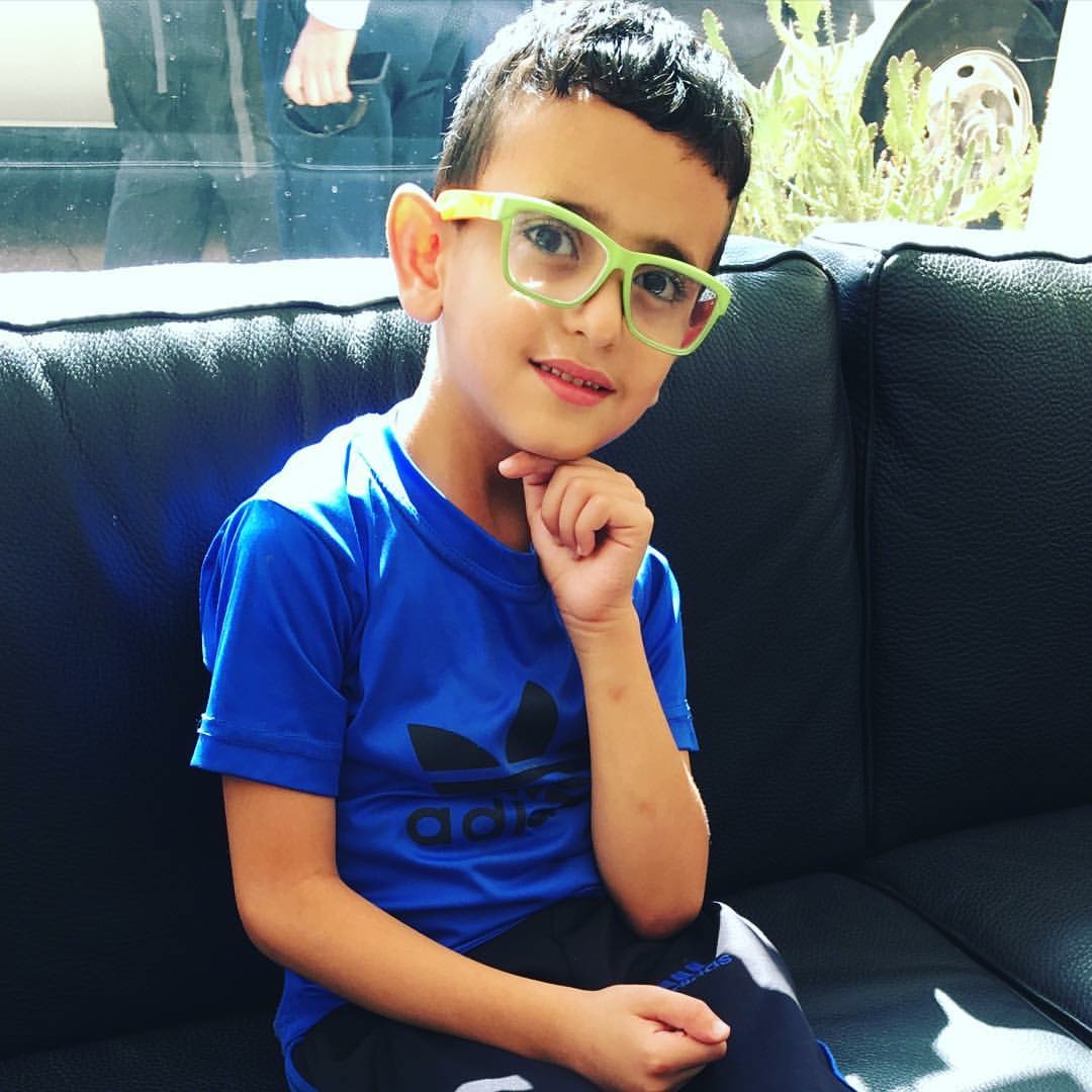 One of the adorable boys who was playing in the center. I LOVE his glasses!