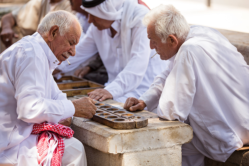 These gentlemen meet in the square daily to chat, play games and smoke their cigarettes