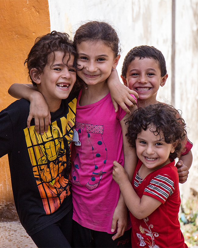 The kids were playing on the stairs as we were touring the city and they were SO excited when I asked if I could take their picture. I love the pure joy on their faces.