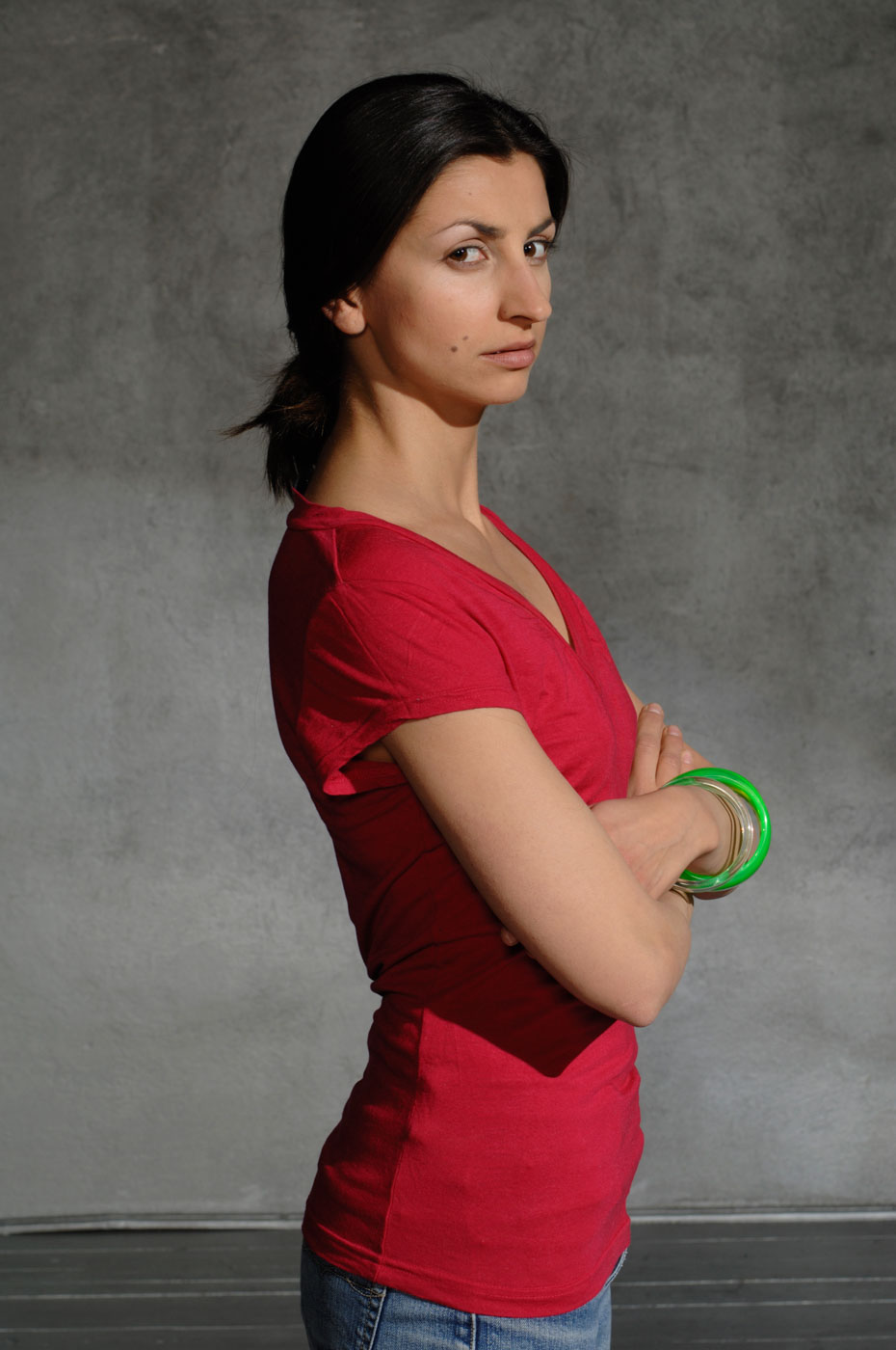 Portrait of a dark-haired girl in a red shirt