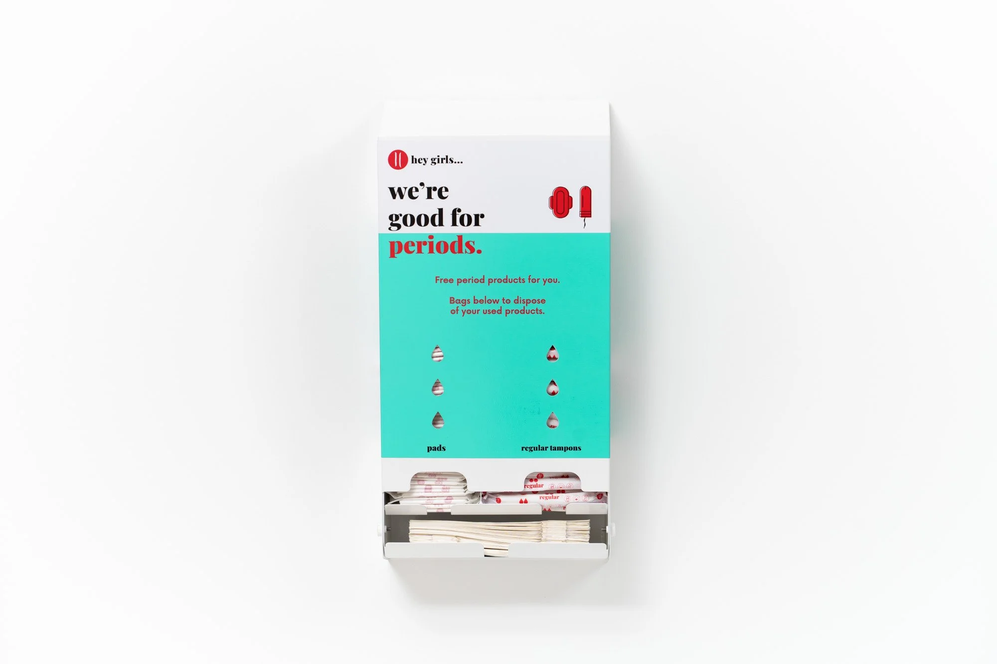 A box of period products, including pads and tampons, with a label that reads 'we're good for periods' and instructions to dispose of used products in the provided bags.