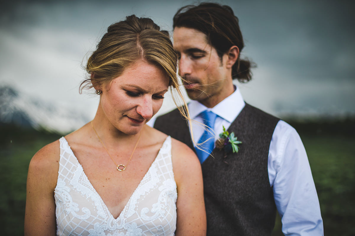 Intimate moment with groom behind bride