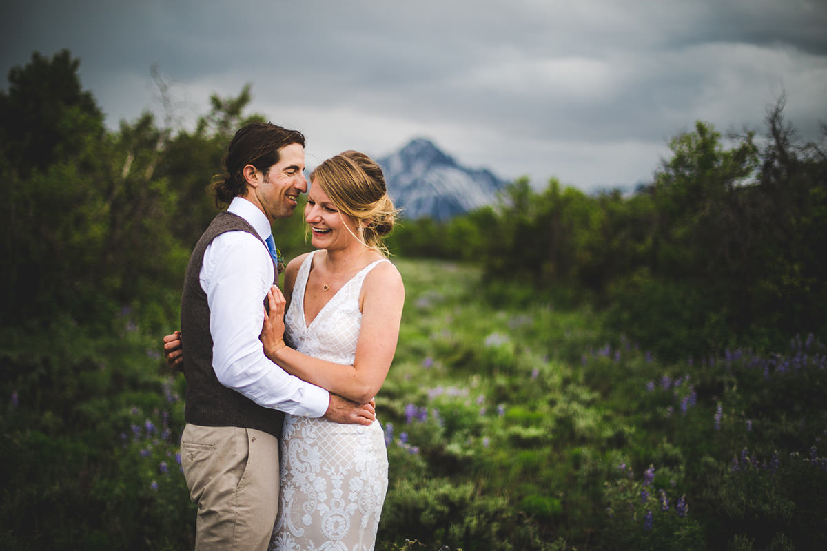 Mount Sneffels in background of bride and groom vibrant portrait