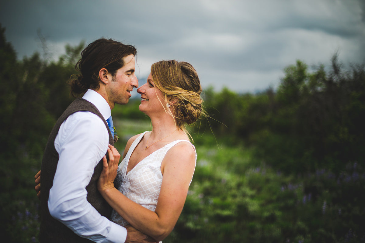 Bride laughing with groom with the San Juans in the background