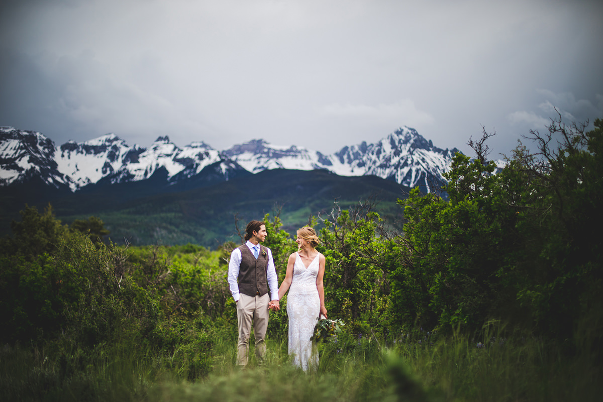 Wide angle of married couple with San Juan mountains in the background