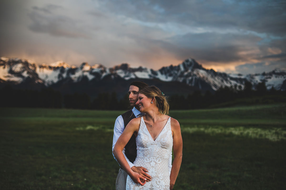 Closeup portrait of man and wife with San Juans in the background