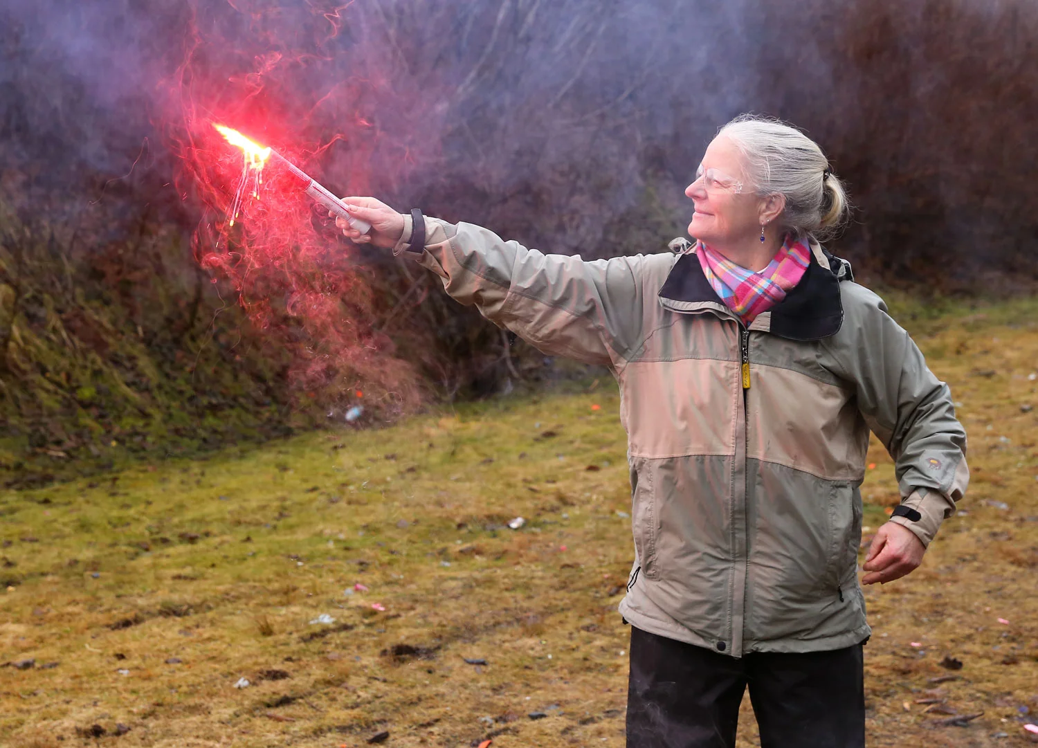 Get a good grip on the bottom of the flare and hold it out over the side of the boat. Stand where you can grasp the boat with your other hand. See the molten plastic dripping from the flare?