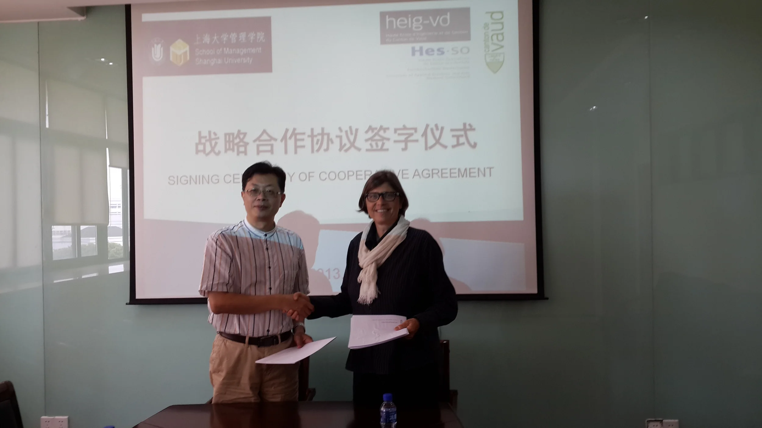 Ms. Maxline Stettler, the Director of International Affairs, Board of Higher Education, Canton of Vaud in Shanghai University, signing cooperative agreement