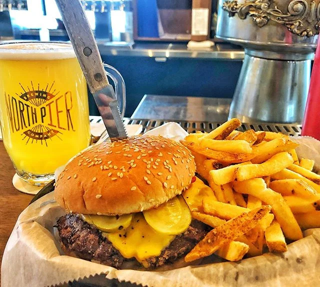 One of the best burgers 🍔 you&rsquo;ll find in Michigan- this is @NorthShoreInn The Classic, half pounder with American cheese, pickle, onion, on a soft sesame seed bun, plus natural cut fries 🍟 . Fell in love with the @NorthPierBrew 415AM White IP