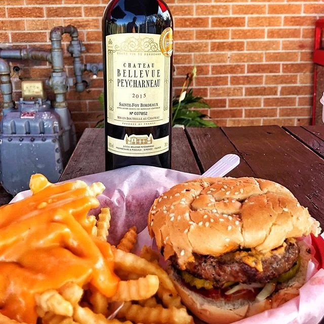 It&rsquo;s #Burger time! My new fav is at @Paradise_Pup- charbroiled medium to perfection, smothered in @Merkts_Cheese, with onion &amp; pickles, on fresh baked roll. Paired that up with a 2015 Bordeaux- Ch Bellevue Peycharneau. A bit tight still, bu
