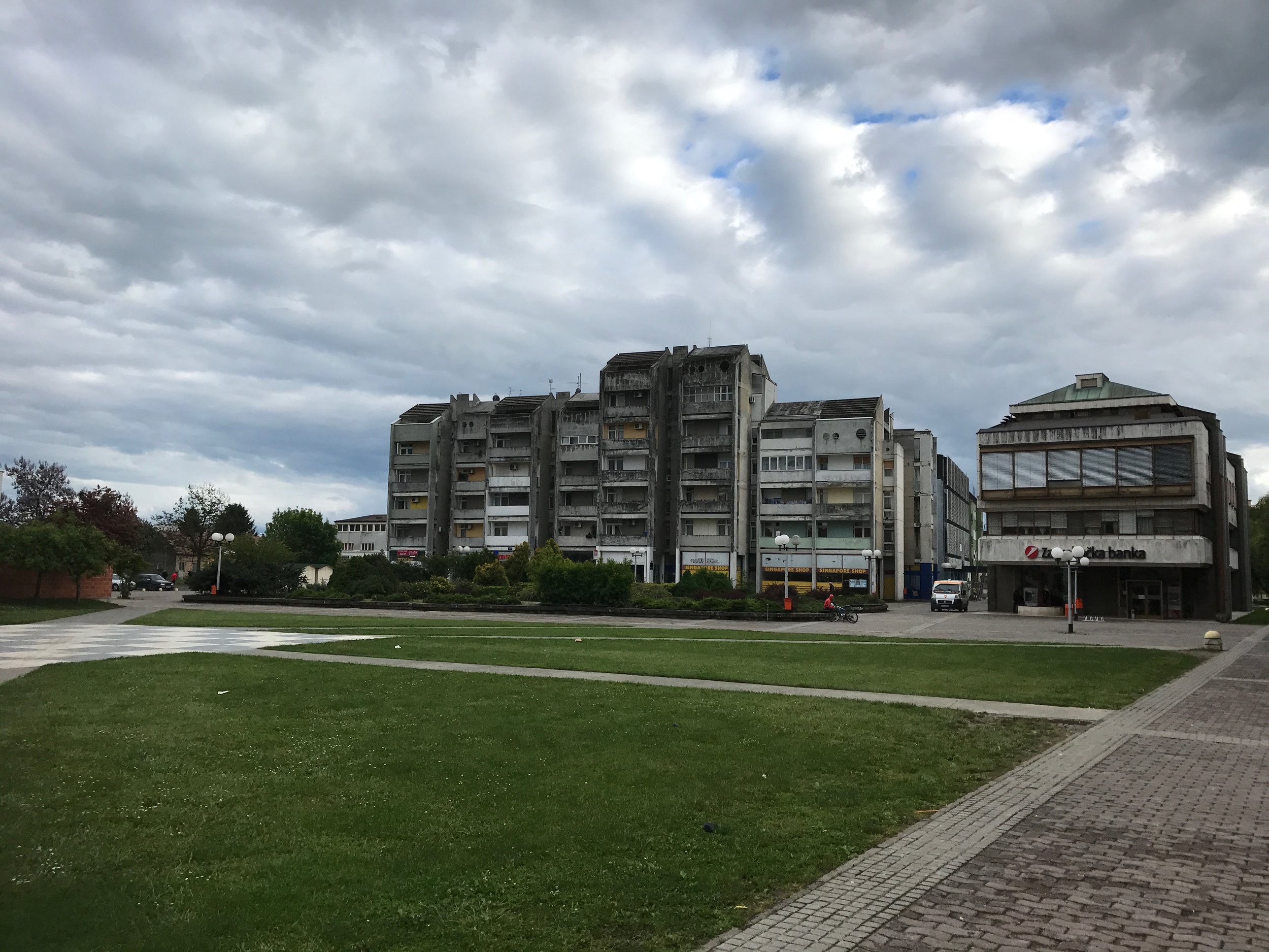 The Serbian Church - well where the Serbian Church was before 1992. Yes, the planted memorial garden in front of the Communist era housing. The steps to the church entrance remain. 