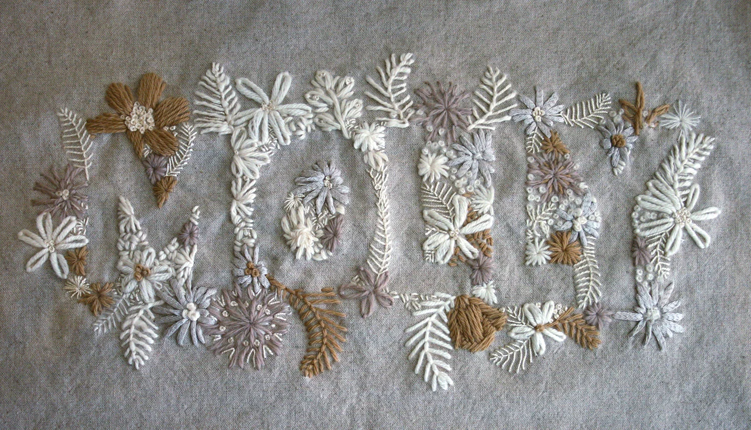 My final embroidery piece and the one that took the most time (and every single piece of remaining yarn - which was a LOT of yarn!) is this negative space version of my daughters name. 