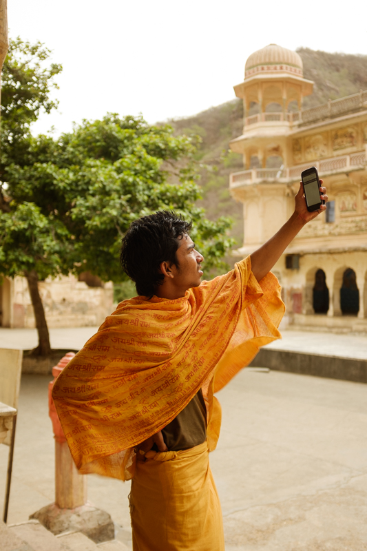 Vijay, searching for signal. / Jaipur, India / May 2014