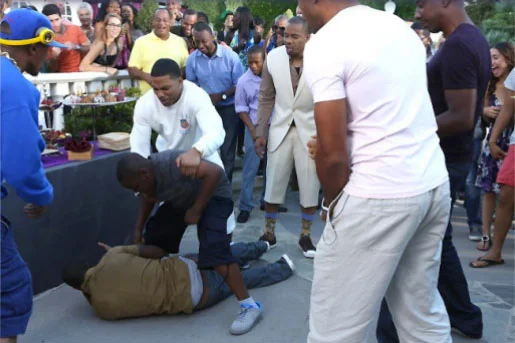 Kevin Hart being beaten up by an eight-year-old boy while Nelly tires to intervene and Nick Cannon looks on. Viva BET!