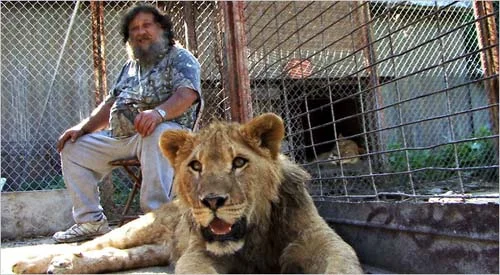 Terry Brumfield and his "pet," Lambert the lion.