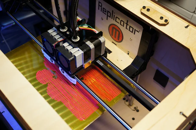 A MakerBot Replicator in action (Credit: Photo by Flickr user Osamu Iwasaki , used with Creative Commons license)