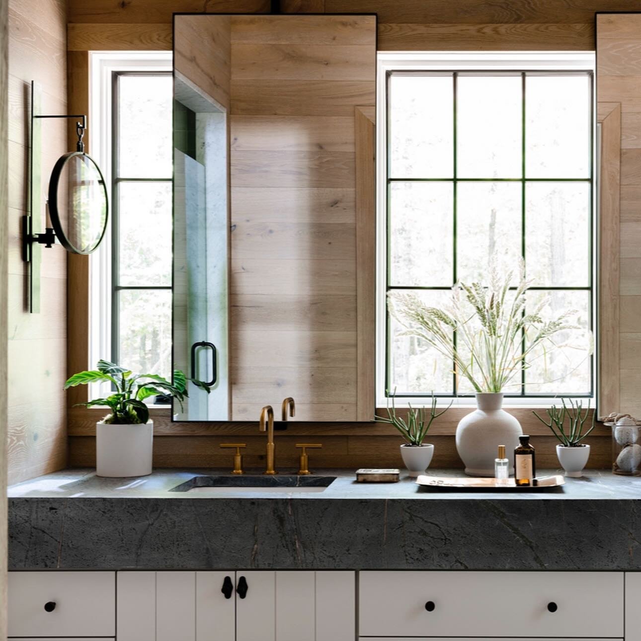 Layers. So many layers. From the mitered countertop and grooved cabinets, to the floating mirrors at the windows and wood walls. Working in perfect harmony together without feeling overwhelming or cluttered.  Go for the extra layer to make your space