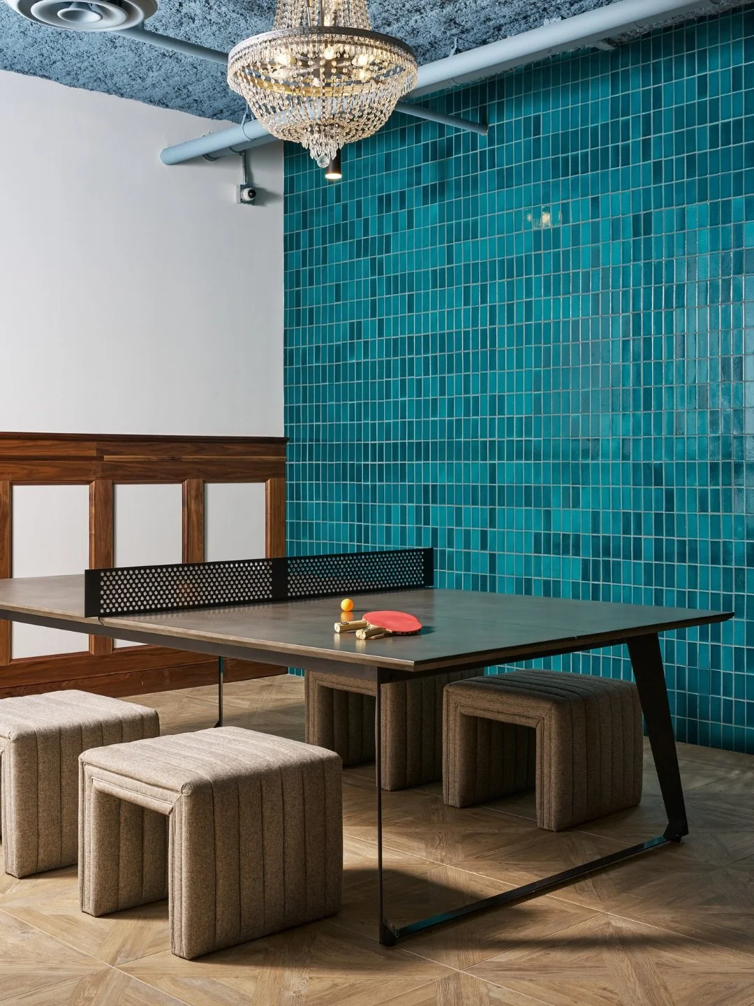 At The Indie, we brought a glamorous, mid-century modern lens to luxury multi-family living in Atlanta&rsquo;s Krog District. Our design blends bold personality with refined materials &mdash; from bright blue tiled accent walls and crystal chandelier