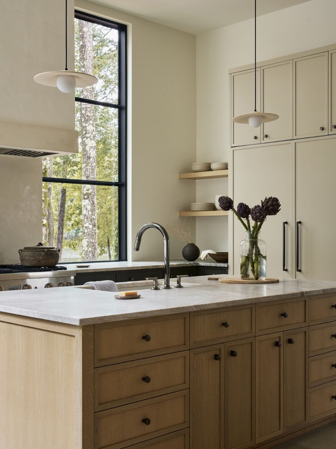 For our Longview project, the kitchen of this lake home needed to feel equal parts functional, inviting, and quietly luxurious &mdash; so we designed it with a timeless, neutral palette and clean architectural lines that let the materials speak for t