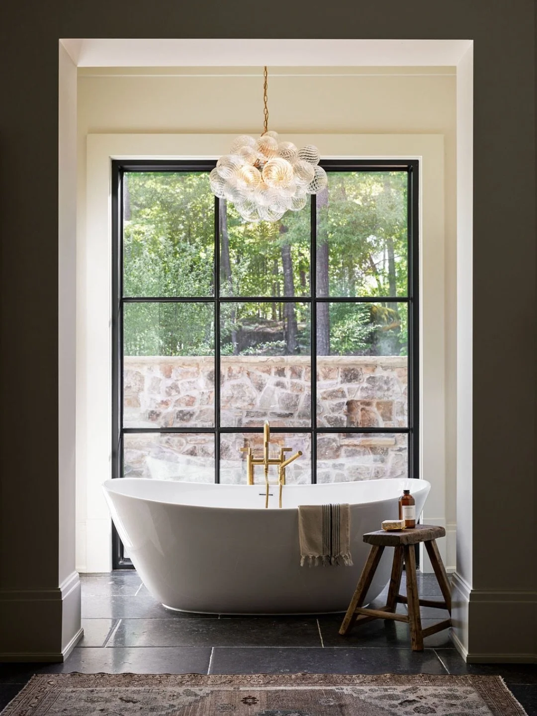 A moment of pure calm. 🤍

In our Rock House project, we placed a freestanding tub in front of the window and added a striking chandelier overhead &mdash; creating a serene, light-filled oasis made for slowing down.

Photo: @aliharper / Assist: @fre8