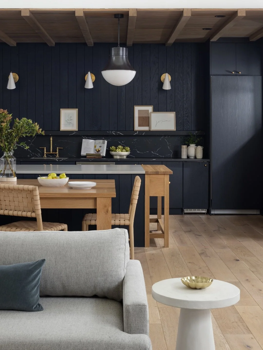 In the community kitchen of our MagnoliaHaus multi-family project, contrast does the heavy lifting &mdash; and the result is a space that feels warm, intentional, and undeniably elevated. 🖤

We paired rich, warm wood tones with black cabinetry to cr