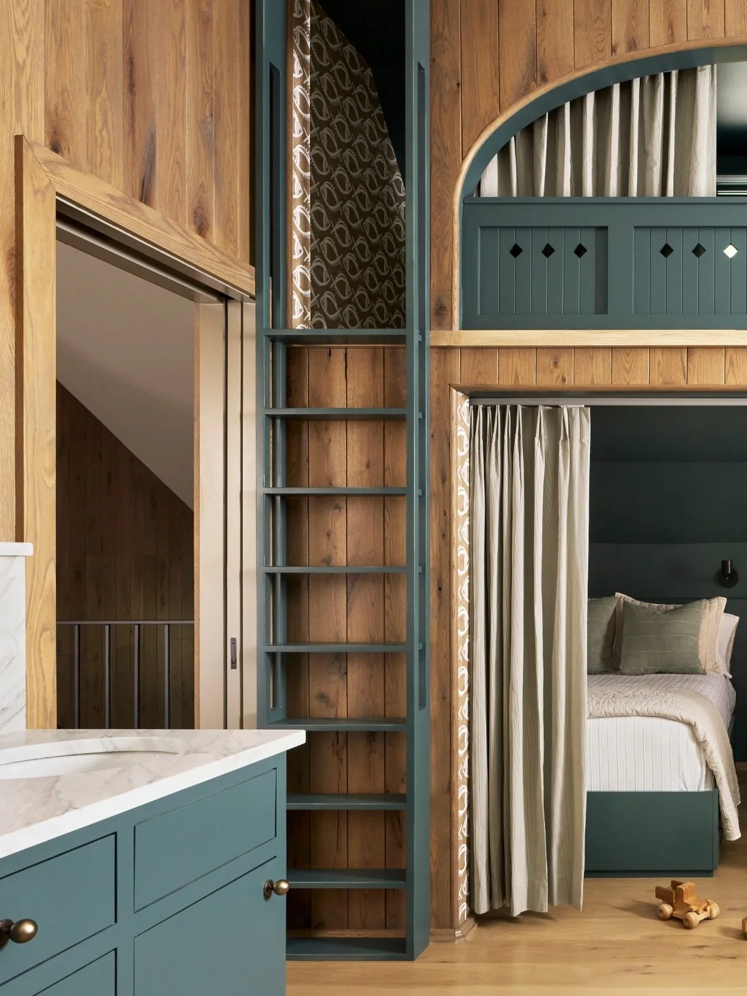 At Wicker Point, the bunkroom suite was designed to feel playful, immersive, and ready for memory-making &mdash; while still feeling completely cohesive with the rest of the home&rsquo;s elevated design. From the custom millwork bunks with painted fi