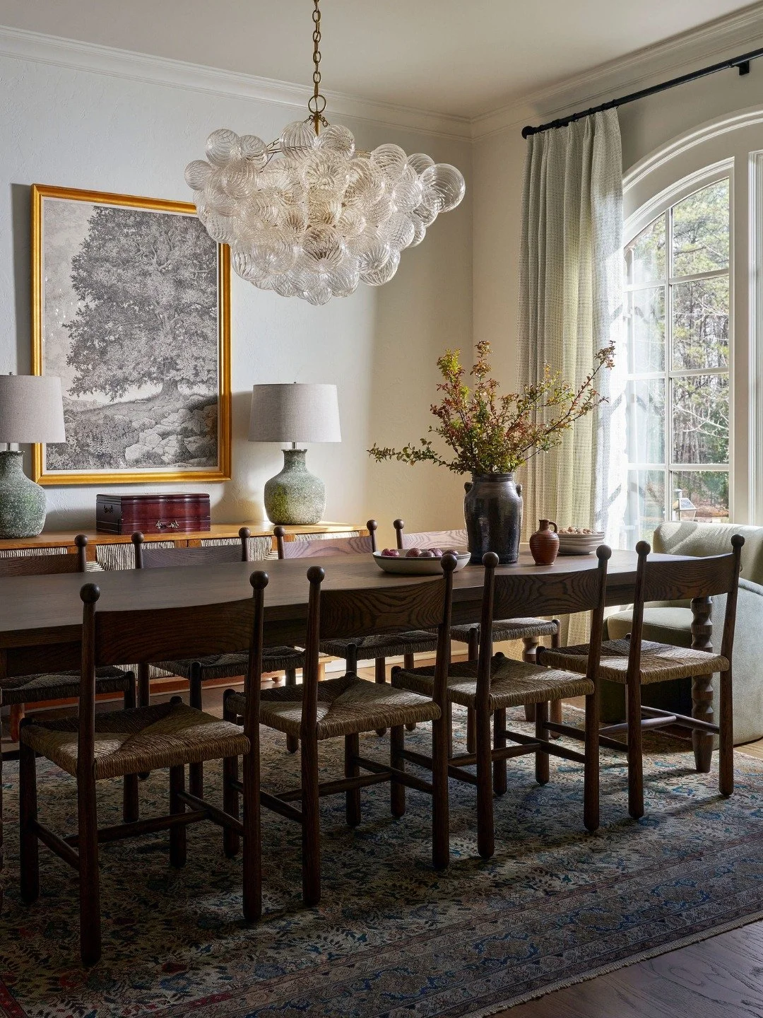 Designed for gathering, lingering, and making everyday moments feel a little more special.

The dining room at our Kennesaw Tudor project balances timeless architecture with a fresh, modern perspective. Rich textures, warm wood tones, organic shapes,