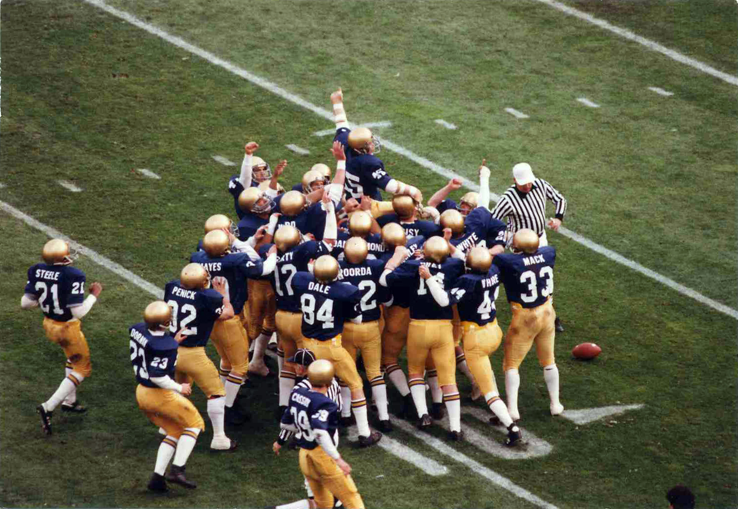 Daniel "Rudy" Ruettiger being carried off the field.