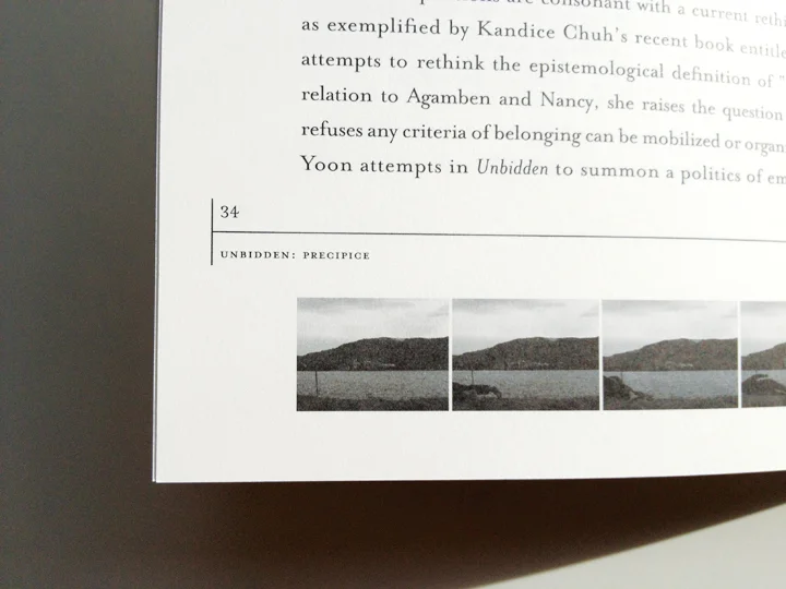 video stills run along the bottom of each page