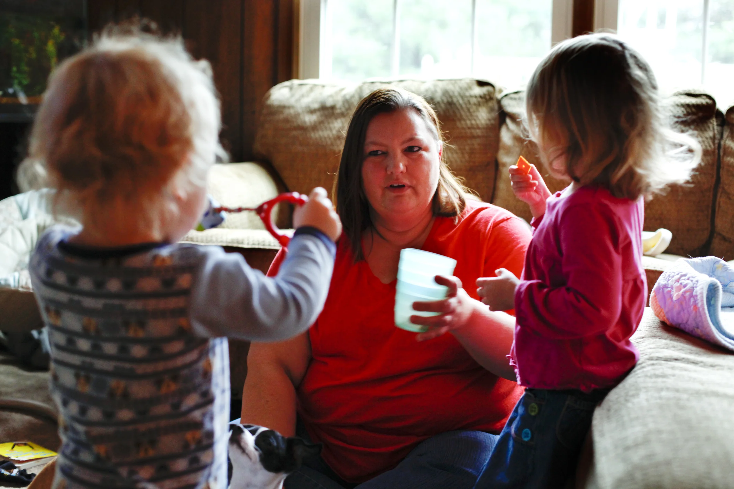 Debbie Lance offers a snack to one of the four children she and her husband are currently fostering. The Lance's have been foster parents since 2008 and have thirteen children, four foster children and nine grandchildren.