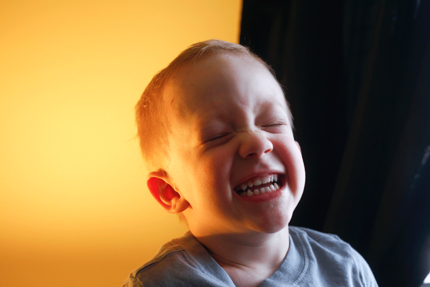 Three year old Sebastian Edelen laughs while playing in his family's home in La Grange. Edelen is in a life-long battle with a form of cancer known as neurofibromatosis that allows tumors to occur anywhere in the body where nerve endings exist.