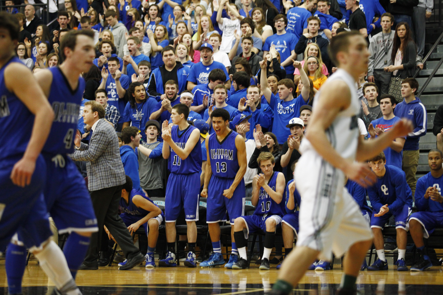 Oldham County junior Kyle Eldridge reacts to his team scoring a point during the Colonels 74-67 win over the Dragons in the final game of the District 29 Basketball Tournament in Goshen. 