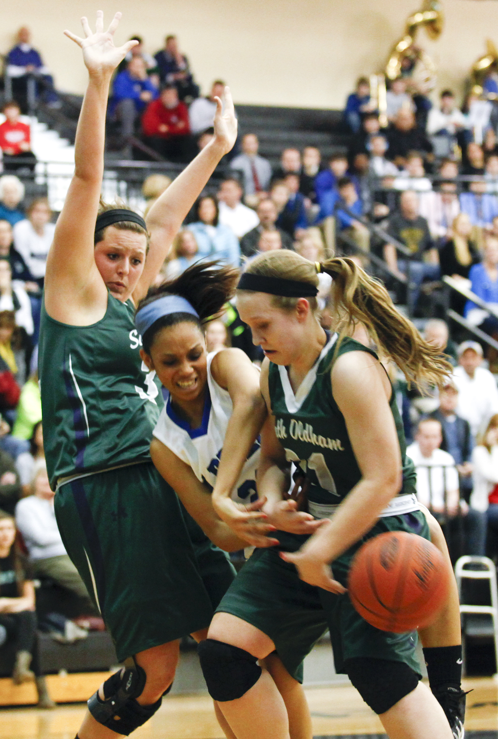 Oldham County guard Jayla Davis looks to take possession after a rebound during the Lady Colonels 50-43 win over the Lady Dragons in the District 29 Girls Basketball Tournament in Goshen.
