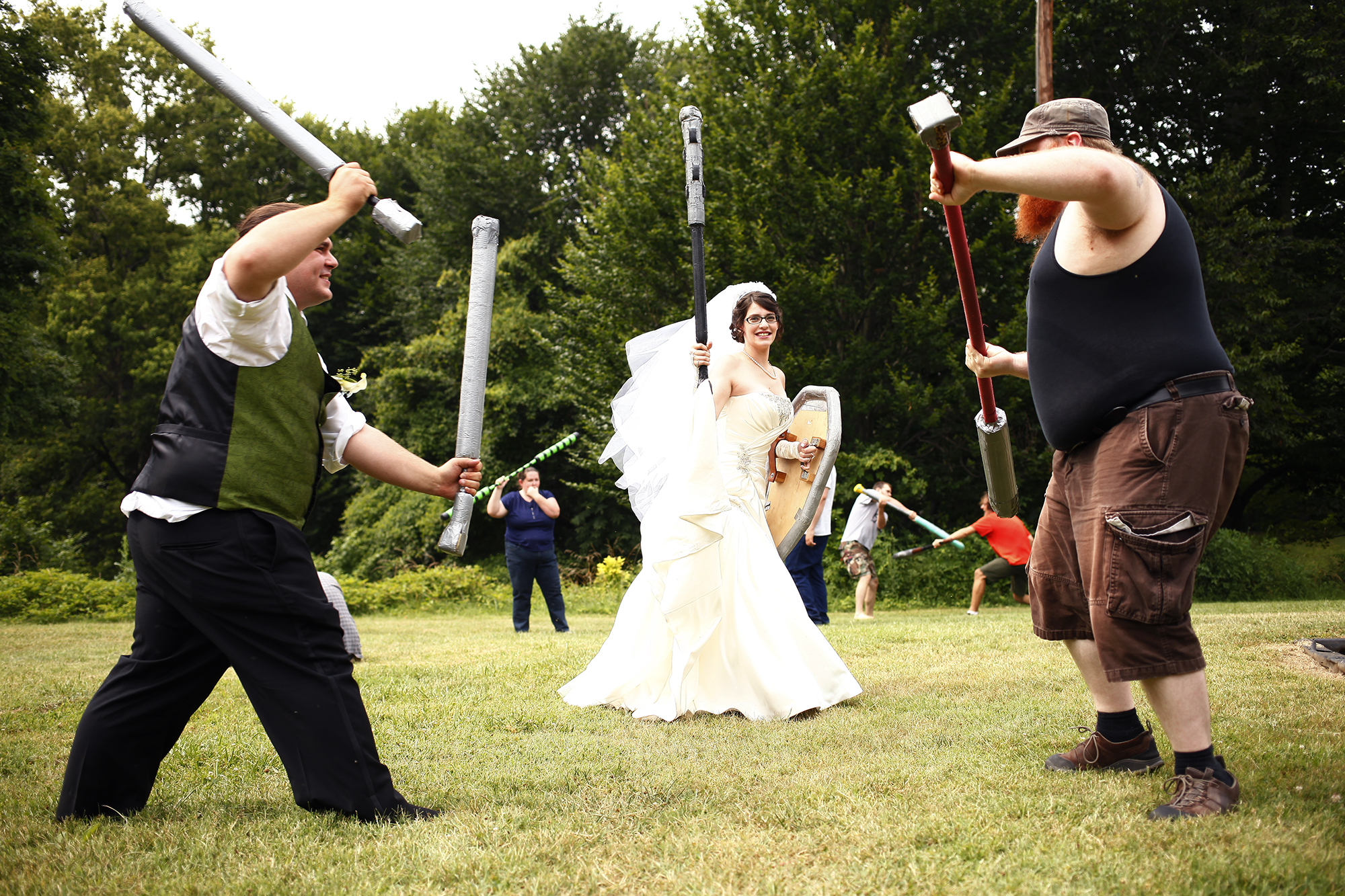 Aaron Mackison and Bekah Calabro stopped by a LARPing Meet and Beat after their nuptials. Live Action Role Playing is a fantasy game played in many different ways across the world. A Meet and Beat was held in Cherokee Park to get new players familiar with the game and weapons, or boffers, used to play.